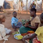 Mozambican child refugees prepare food at Kapise camp in Malawi's Mwanza district January 18, 2016.   REUTERS/Eldson Chagara
