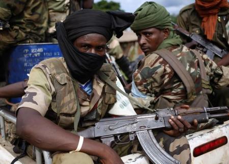 Seleka fighters sit in a vehicle in a village between Bambari and Grimari May 31, 2014. Picture taken  May 31, 2014.  REUTERS/Goran Tomasevic