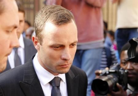 Olympic and Paralympic track star Oscar Pistorius reacts at the end of his trial at the North Gauteng High Court in Pretoria April 10, 2014. REUTERS/Siphiwe Sibeko