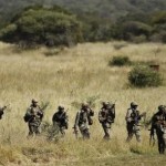 Members of the South African National Defence Force (SANDF) return after taking part in a Capability Demonstration at the Roodewal Bombing Range in Makhado, in the northern province of Limpopo, May 9, 2013.    REUTERS/Siphiwe Sibeko