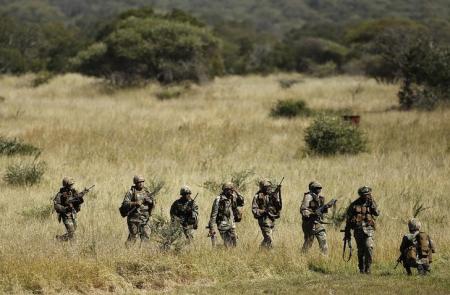 Members of the South African National Defence Force (SANDF) return after taking part in a Capability Demonstration at the Roodewal Bombing Range in Makhado, in the northern province of Limpopo, May 9, 2013.    REUTERS/Siphiwe Sibeko