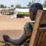A former child combatant, 14, who used to be a member of the anti-balaka rebel group sits outside her school building in Bambari, Central African Republic November 10, 2015. The girl's identity is being protected by UNICEF, the U.N.'s children’s agency, after it helped her leave the armed faction to pursue her education. The girl had admitted to playing a role in killing members of an opposing armed group to avenge the death of two male relatives. Picture taken November 10, 2015. To match Feature CENTRALAFRICA-CHILDSOLDIERS/     REUTERS/Tom Esslemont/Thomson Reuters Foundation