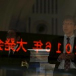 A visitor waits for the New Year opening ceremony at the Tokyo Stock Exchange (TSE), held to wish for the success of Japan's stock market, in Tokyo, Japan, January 4, 2016. REUTERS/Yuya Shino