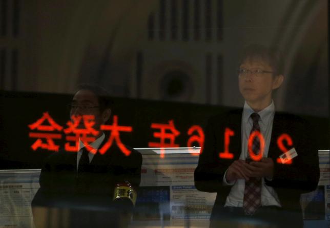 A visitor waits for the New Year opening ceremony at the Tokyo Stock Exchange (TSE), held to wish for the success of Japan's stock market, in Tokyo, Japan, January 4, 2016. REUTERS/Yuya Shino