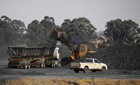 Coal is loaded onto a truck at the Woestalleen colliery near Middleburg in Mpumalanga province, September 8, 2015. REUTERS/Siphiwe Sibeko