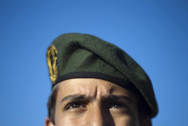 A member of Iran's Revolutionary guard stands at attention during an anti-U.S. ceremony in Azadi (freedom) Square in Tehran April 25, 2010. REUTERS/Morteza Nikoubazl