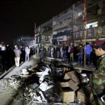 Iraqi security forces gather at the site of a car bomb in New Baghdad, January 11, 2016. REUTERS/Ahmed Saad