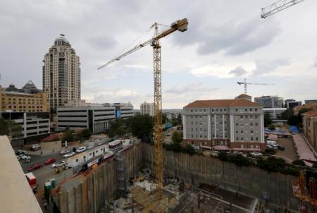 Construction is seen below the skyline of Johannesburg's upmarket Sandton suburb, February 5, 2016.  . REUTERS/Mike Hutchings