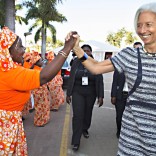 This handout photo released by the International Monetary Fund (IMF) shows IMF Managing Director Christine Lagarde (R) being greeted by local singers as she attends the opening session of the Africa Rising Conference, on May 29, 2014 at the Chissano Conference Center in Maputo.  Lagarde attends on May 29 a two-day major conference in Maputo that will bring together policymakers from across the region. AFP PHOTO / IMF / STEPHEN JAFFE 
-- RESTRICTED TO EDITORIAL USE - MANDATORY CREDIT " AFP PHOTO / IMF / STEPHEN JAFFE " - NO MARKETING NO ADVERTISING CAMPAIGNS - DISTRIBUTED AS A SERVICE TO CLIENTS --