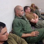 An undated picture released by Iran's Revolutionary Guards website shows American sailors sitting in a unknown place in Iran.   REUTERS/sepahnews.ir/TIMA/Handout via Reuters