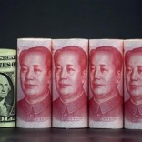Chinese 100 yuan banknotes and a U.S. one dollar banknote are seen in this picture illustration in Beijing, China, January 21, 2016. REUTERS/Jason Lee