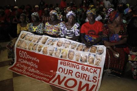 Parents of the Chibok girls hold a "Bring Back Our Girls" banner during their meeting with Nigeria's President Muhammadu Buhari at the presidential villa in Abuja, Nigeria, January 14, 2016. REUTERS/Afolabi Sotunde