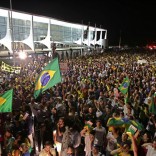 Demonstrators call for the impeachment of Brazil's President Dilma Rousseff and protest the naming of her mentor, former President Luiz Inacio Lula da Silva, as her new chief of staff, outside Planalto presidential palace in Brasilia, Brazil, Wednesday, March 16, 2016. Supporters say the move will help the president fight impeachment proceedings and critics blast it as a scheme to shield Lula from possible detention in corruption probes. (AP Photo/Eraldo Peres)