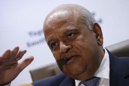 South Africa's Finance Minister, Pravin Gordhan gestures during a media briefing after he was reappointed to the position on Sunday night by President Jacob Zuma in Pretoria, South Africa December 14, 2015. REUTERS/Siphiwe Sibeko