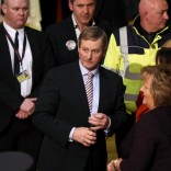 Irish Prime Minister Enda Kenny (C) departs the general election count at the count centre in Castlebar, Ireland February 27, 2016. REUTERS/Clodagh Kilcoyne