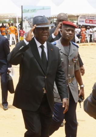 Ivory Coast's President Alassane Ouattara arrives to attend a ceremony in tribute to the victims of the Grand Bassam shooting, at a stadium in Grand Bassam, Ivory Coast, March 20, 2016. REUTERS/Thierry Gouegnon