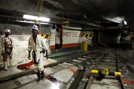 Miners are seen underground at Lonmin Plc's Karee mine in Marikana, Rustenburg 100 km (62 miles) northwest of Johannesburg, March 5, 2013.    REUTERS/Siphiwe Sibeko