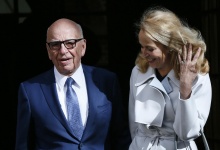 Media mogul Rupert Murdoch and Jerry Hall pose for a photograph in London. REUTERS/Stefan Wermuth