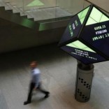 A man walks through the lobby of the London Stock Exchange in London, Britain August 25, 2015. REUTERS/Suzanne Plunkett