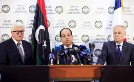 A member of the Presidential Council of Government of National Accord, Ahmed Maiteeq (C) stands next to German Foreign Minister Frank-Walter Steinmeier (L) and French Foreign Minister Jean-Marc Ayrault (R) dueing a joint news conference in Tripoli, Libya, April 16, 2016. REUTERS/Ismail Zitouny      TPX IMAGES OF THE DAY