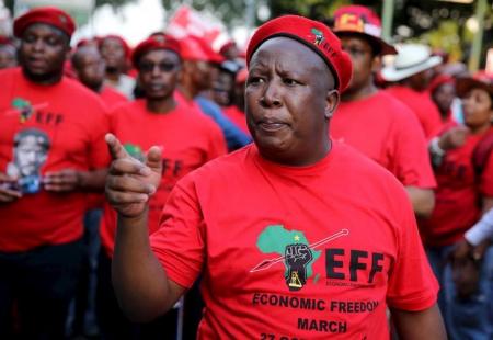 Leader of South Africa's left-wing Economic Freedom Fighters (EFF) Julius Malema gestures after arriving at the Johannesburg Stock Exchange (JSE) in Sandton, October 27, 2015.    REUTERS/Siphiwe Sibeko
