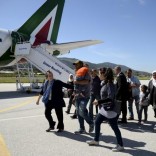 A group of Syrian refugees arrive to board a plane with Pope Francis at the airport of Mytilene, in the Greek island of Lesbos, April 16, 2016. REUTERS/Filippo Monteforte/Pool