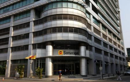A woman walks past the head office of Angolan state oil company Sonangol in the capital Luanda, August 26, 2012. Picture taken August 26, 2012. REUTERS/Siphiwe Sibeko
