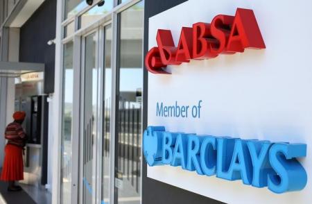 A woman uses an ATM at a branch of Barclays South African subsidiary Absa bank in Johannesburg, in this picture taken  March 6,2016. REUTERS/Siphiwe Sibeko