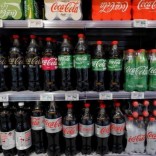 Bottles of Coca-Cola are displayed in a shop in Paris, France, April 11, 2016.  REUTERS/Philippe Wojazer