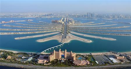 An aerial view of Atlantis hotel is seen with The Palm Jumeirah in Dubai in this December 21, 2009 file photo. The revolts that began in Tunisia at the end of 2010 and spread across the Middle East and North Africa had a devastating impact on tourism, but not everyone in the region lost out. While recovery from the turmoil has been at best tentative, at worst non existent, places where the Arab Spring has not reached have been unexpected beneficiaries. REUTERS/Matthias Seifert/Files