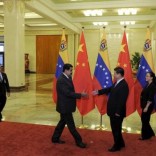 File photo of Chinese President Xi Jinping preparing to shake hands with Venezuelan President Nicolas Maduro before their meeting at the Great Hall of the People in Beijing, China, September 1, 2015. REUTERS/Parker Song/Pool