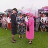 Britain's Queen Elizabeth speaks to Commander Lucy D'Orsi during a garden party at Buckingham Palace in London, in this still image taken from video, Britain, May 10, 2016. REUTERS/ROYAL POOL via Reuters TV