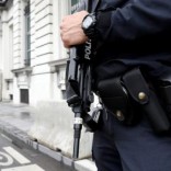 A Belgian police officer stands guard outside a meeting of the government's security council in Brussels, Belgium, June 18, 2016. REUTERS/Francois Lenoir