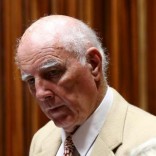 Former Grand Slam doubles champion Bob Hewitt looks on ahead of court proceedings at the  South Gauteng High Court in Johannesburg February 10, 2015.   REUTERS/Siphiwe Sibeko
