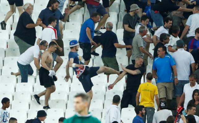 Football Soccer - England v Russia - EURO 2016 - Group B - Stade V?lodrome, Marseille, France - 11/6/16
England fans try to escape trouble in the stadium at full time
REUTERS/Eddie Keogh
Livepic
 - RTX2FPC1