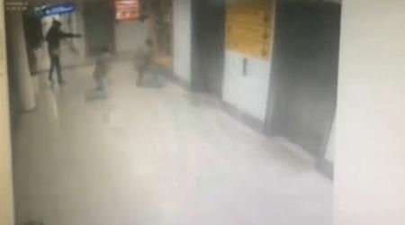 A still image from CCTV footage from Istanbul airport, Turkey released June 30, 2016 shows an attacker shooting a plain clothes police officer at point blank range with a pistol on June 28, 2016.   HABERTURK via Reuters TV
