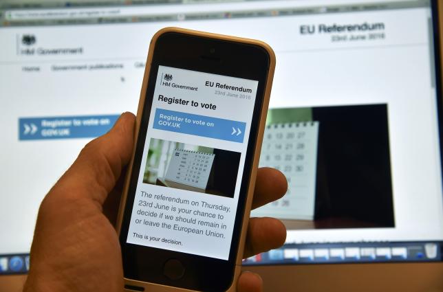 A web page on a voting registration site for the forthcoming British EU referendum is seen on a laptop computer and a smart phone in London, Britain, June 8, 2016. REUTERS/Toby Melville