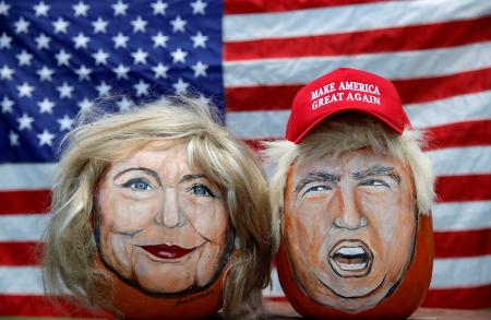 The images of U.S. Democratic presidential candidate Hillary Clinton (L) and Republican Presidential candidate Donald Trump are seen painted on decorative pumpkins created by artist John Kettman in LaSalle, Illinois, U.S., June 8, 2016.     REUTERS/Jim Young