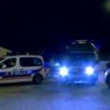 Still image taken from video shows Police vehicles at the scene near where a French police commander was stabbed to death in front of his home in the Paris suburb of Magnanville, France, June 14, 2016.   REUTERS/Reuters TV