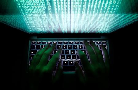 A man types on a computer keyboard in Warsaw in this February 28, 2013 illustration file picture. REUTERS/Kacper Pempel/Files