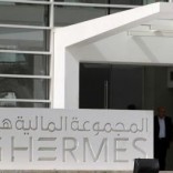 People exit the new headquarters of Egypt-based investment bank EFG-Hermes, on the outskirts of Cairo, October 19, 2010.   REUTERS/Asmaa Waguih