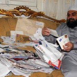 Egyptian cleric Hassan Mustafa Osama Nasr, also known as Abu Omar, shows letters of well wishes from his supporters from around the world during a Reuters interview in his house in Alexandria, Egypt May 13, 2008. REUTERS/Stringer