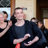 Artist Pyotr Pavlensky applauds after he was release from the court room in Moscow, Russia, June 8, 2016.  REUTERS/Maxim Zmeyev