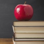 Apple and stack of books