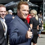 Actor Arnold Schwarzenegger reacts as he arrives at the Australian Formula One Grand Prix in Melbourne. REUTERS/Brandon Malone