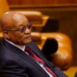 President Jacob Zuma looks on as members of Julius Malema's Economic Freedom Fighters (EFF) party raise objections before being evicted from Parliament during his question and answer session in Cape Town, South Africa, May 17, 2016.  REUTERS/Mike Hutchings