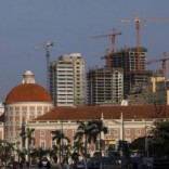 Office buildings under construction stand behind the Angolan central bank building in the capital, Luanda, in this file photo. REUTERS/Mike Hutchings/Files