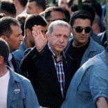 Turkish President Recep Tayyip Erdogan waves to the crowd following a funeral service for a victim of the thwarted coup in Istanbul, Turkey, July 17, 2016. REUTERS/Alkis Konstantinidis