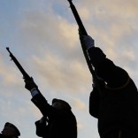 The American Legion Post 100 rifle squad fires a volley during Veterans Day ceremonies in Pelham, New Hampshire November 11, 2014.        REUTERS/Brian Snyder    (UNITED STATES - Tags: MILITARY TPX IMAGES OF THE DAY) - RTR4DS2U
