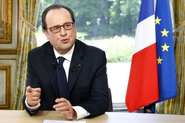 French President Francois Hollande gestures after a televised interview at the Elysee Palace where he said that France will not extend a state of emergency put in place after the November 2015 attacks beyond July 26, following the Bastille Day military parade in Paris, France, July 14, 2016. REUTERS/Francois Mori/Pool